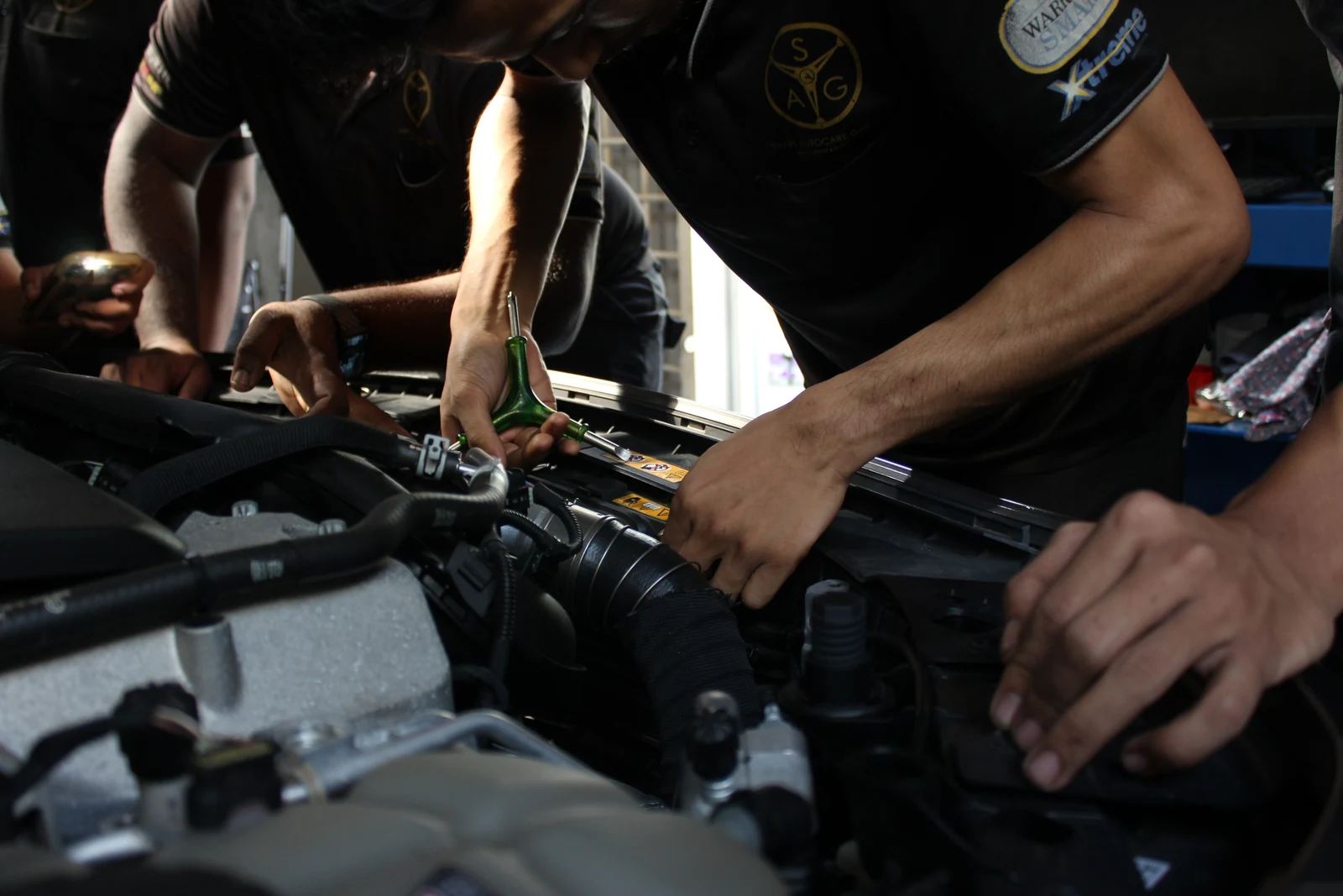 SAG technician repairing a vehicle